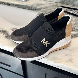 Michael Kors Women’s Black and Tan Slip-On Sneakers